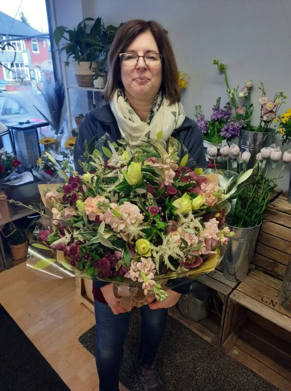 Rhiann Jones with an arrangement at The Flower Fountain, where Floral Pulse began